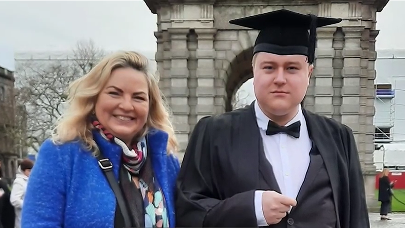 Lady and graduating student in the grounds of Trinity College, Dublin